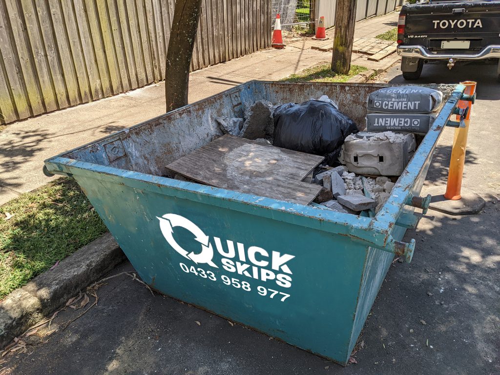 Small rubbish two cubic meter skip bin hired in the inner west of Sydney without door.