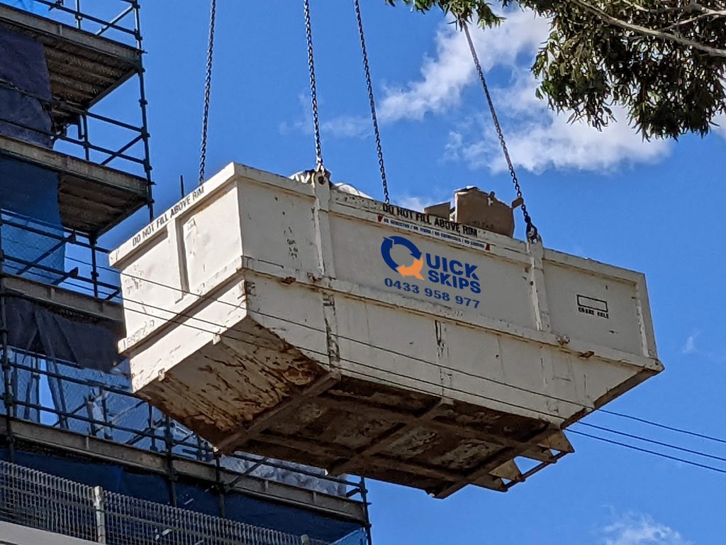Craneable skip bins being raised over power lines, order a skip bin near me in Rouse Hill, Kellyville, 2155 Sydney