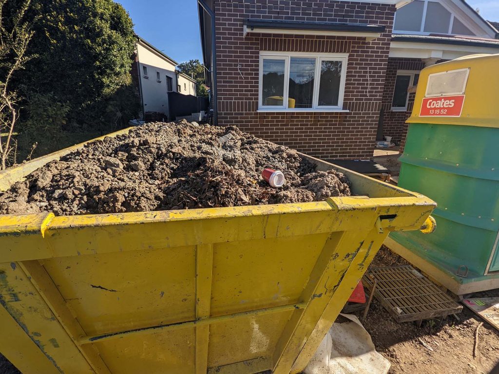 Skip bin hire Ryde 2112 filled with clay dirt, Yellow 6 cubic metre skip bin price